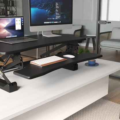 Mount-It! Standing Desk Converter, 48" Wide Sit Stand Desk Riser with Dual Gas Spring Handles, Height Adjustable from 6"–19.25", Extra Large Tabletop for 2 Monitors, Keyboard Tray & Device Slot, Black